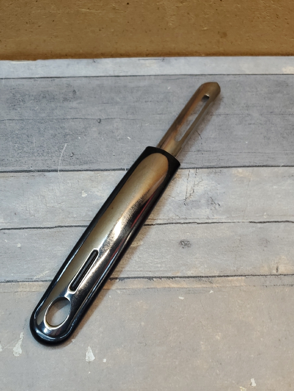 Stainless Steel Vegetable Peeler with Black Handle